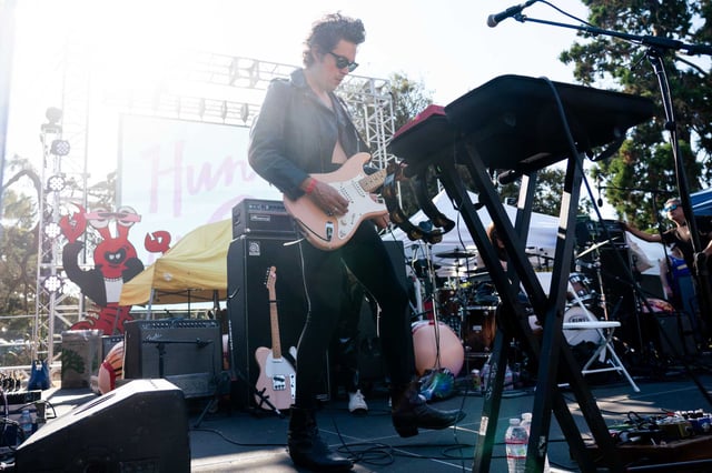 Guitarist Nik Johnson of the Bay Area based punk band Hunx and His Punx performs during the Mosswood Meltdown in Oakland on July 6, 2024. The East Bay garage rock band has signed an open letter alongside Ariana Grande, Pedro Pascal, and over 100 public figures, calling on federal leaders to preserve funding for LGBTQ+ youth suicide prevention services.