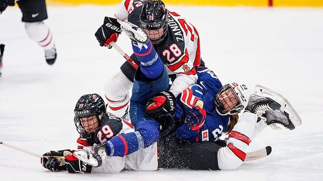 Canada’s Marie-Philip Poulin, left, and Micah Zandee-Hart, middle, pictured at 2022 women’s hockey championship in Denmark. The tourney was held in August and September that year after February's Olympics in Beijing. 
