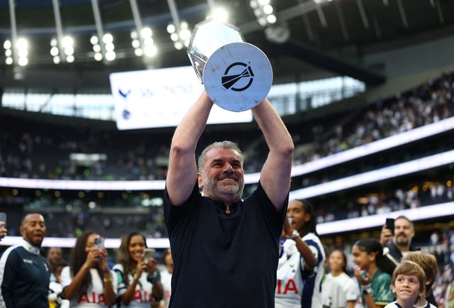 Soccer Football - Premier League - Tottenham Hotspur v Brighton & Hove Albion - Tottenham Hotspur Stadium, London, Britain - May 25, 2025, Tottenham Hotspur manager Ange Postecoglou holds aloft the Europa League trophy during a lap of appreciation after the match Action Images via Reuters/Matthew Childs/File Photo