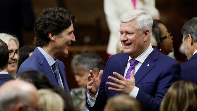 Canada’s former prime ministers Justin Trudeau (left) and Stephen Harper speak, on the day Britain's King Charles and Queen Camilla visit the Senate of Canada Building in Ottawa, Ontario, on May 27. (REUTERS)