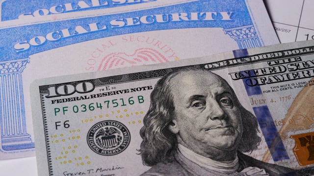 Stock image/file photo: A Social Security card with U.S. Dollars.