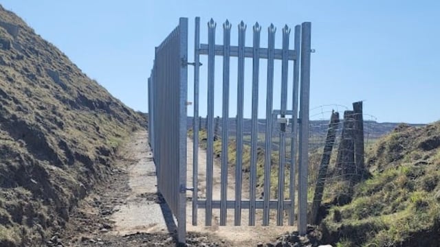 Council officials erected the fence because of fears that a mountain could collapse onto the road below