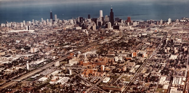 An aerial view of Chicago, showing the downtown skyline and surrounding neighborhoods, and Lake Michigan in the background, late twentieth century. (Photo by The Abbott Sengstacke Family Papers/Robert Abbott Sengstacke/Getty Images)