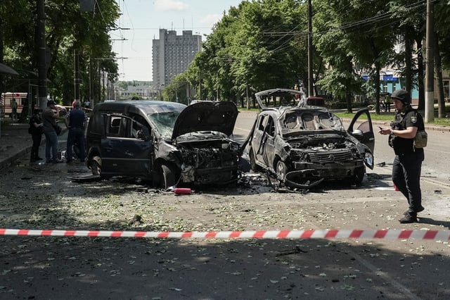 Police officers stand at the site of Russian missile strike, amid Russia's attack on Ukraine in Sumy, June 3, 2025. REUTERS/Stringer
