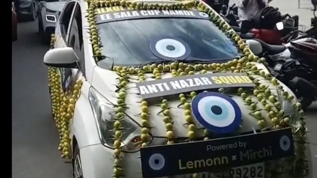 A car in Bengaluru was wrapped up with lemons and chillis to clear the 'nazar' factor of RCB. 