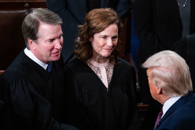 Supreme Court Justices Brett Kavanaugh and Amy Coney Barrett greet President Donald Trump after his address to a joint session of Congress at the US Capitol on March 4.