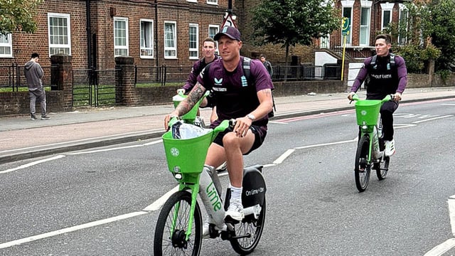 England's Harry Brook, Brydon Carse and Matthew Potts arrive on bicycles before the match 