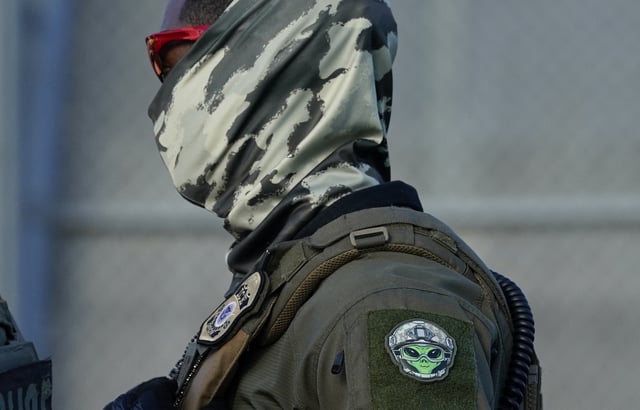 An Immigration and Customs Enforcement agent wearing a mask in Elizabeth, New Jersey, on May 7, 2025.
