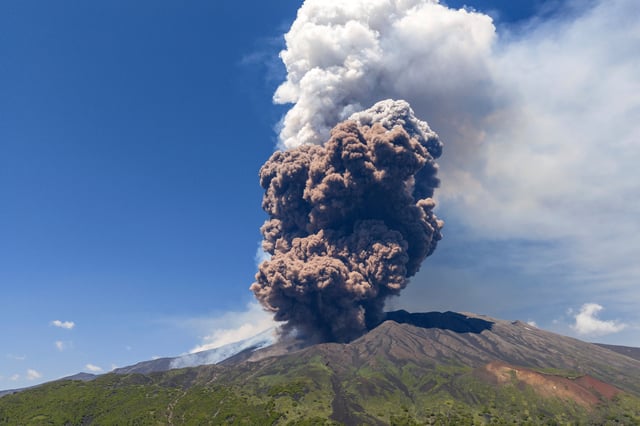 Smoke billows from Mount Etna volcano, Italy, Monday, June 2, 2025. (AP Photo/Giuseppe Distefano)