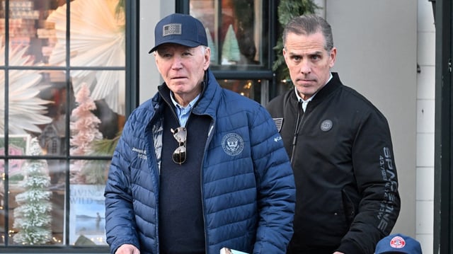 Joe Biden with his son Hunter, who is among five family members pardoned