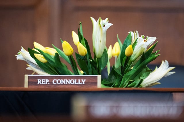 Flowers to honor the late Rep. Gerald E. Connolly, D-Va., are seen at a House Foreign Affairs Committee hearing on May 21. (Tom Williams/CQ Roll Call)