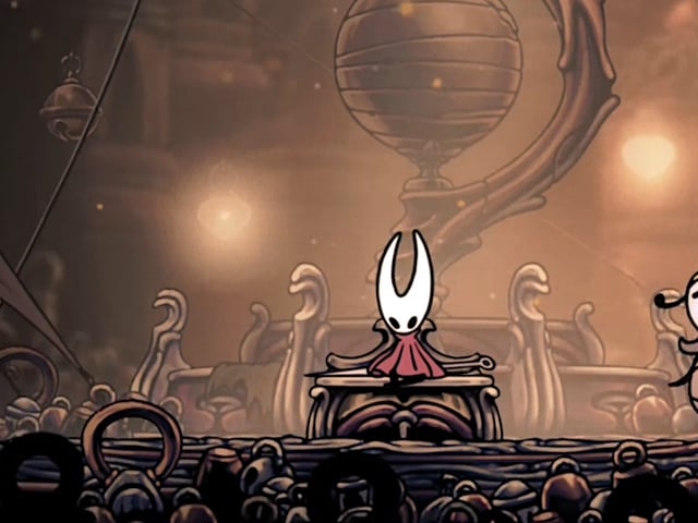 Hornet from Hollow Knight: Silksong is seated, morose, on a bench.