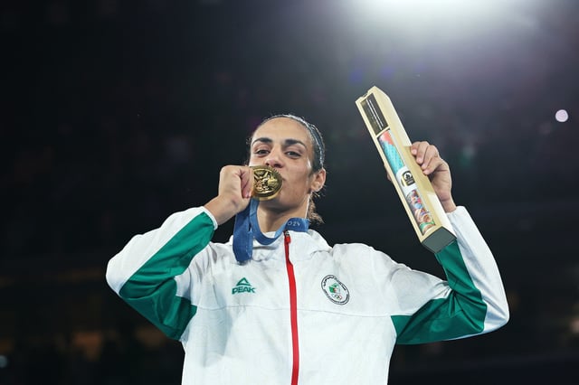 Gold Medallist Imane Khelif of Team Algeria kisses her medal during the Boxing Women&#39;s 66kg medal ceremony after the Boxing Women&#39;s 66kg Final match on day fourteen of the Olympic Games Paris 2024 at Roland Garros on August 09, 2024 in Paris, France. (Photo by Richard Pelham/Getty Images)