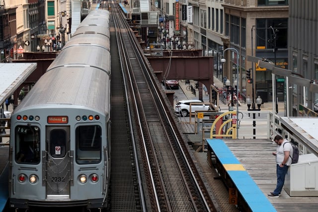 Commuters await their trains at the Adams/Wabash CTA station platform in Chicago on June 2, 2025. (Antonio Perez/Chicago Tribune)
