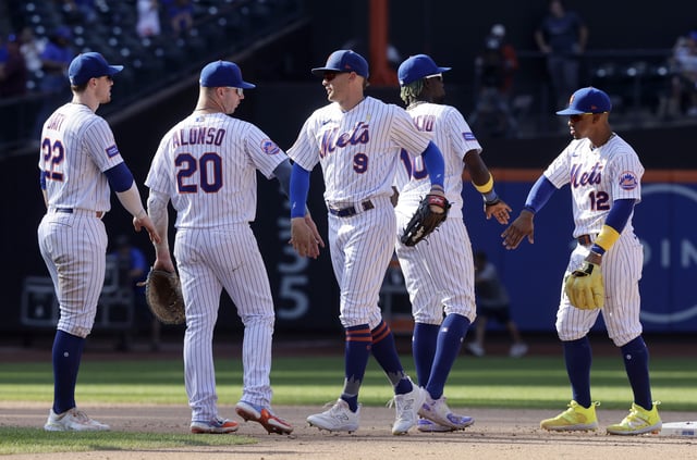 (L-R) Brett Baty #22, Pete Alonso #20, Brandon Nimmo #9, Ronny Mauricio #10 and Francisco Lindor #12 of the New York Mets celebrate after defeating the Seattle Mariners at Citi Field on September 03, 2023 in New York City.