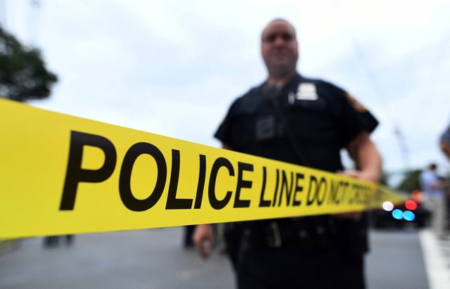 A police officer secures an area following a shooting in Linden, New Jersey on September 19, 2016.