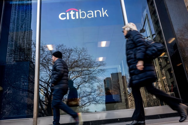 People walk by a CitiBank location in Manhattan on March 1, 2024 in New York.