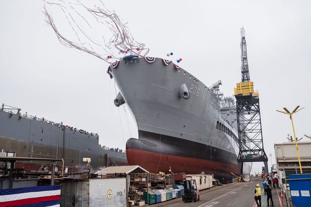 USNS Harvey Milk departs the General Dynamics NASSCO shipyard after a ceremonial address in San Diego, California on November 6, 2021.