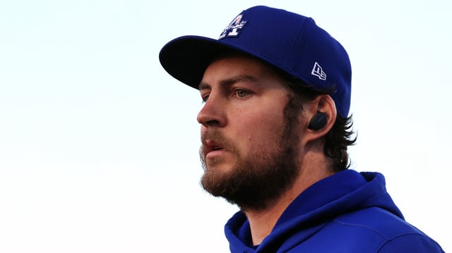 Trevor Bauer of the Los Angeles Dodgers looks on before an MLB spring training game against the Seattle Mariners at Peoria Sports Complex on March 22, 2021 in Peoria, Ariz.