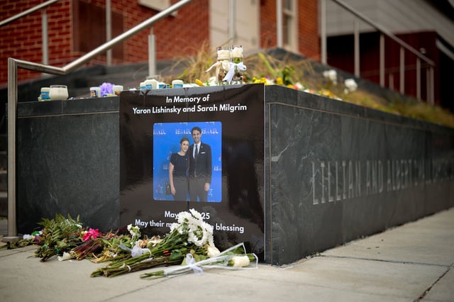 A photograph of Sarah Lynn Milgrim and Yaron Lischinsky is displayed outside the Lillian and Albert Small Capital Jewish Museum on May 29, 2025 in Washington, DC.