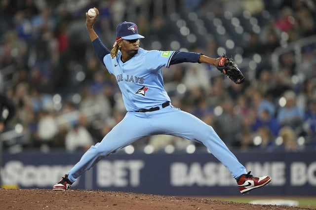 May 29, 2025; Toronto, Ontario, CAN; Toronto Blue Jays pitcher Jose Urena (48) pitches to the Athletics during the eighth inning at Rogers Centre. Mandatory Credit: John E. Sokolowski-Imagn Images