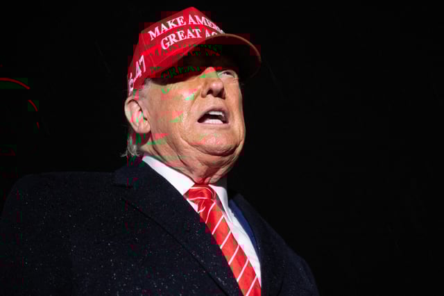 US President Donald Trump speaks to the press in the rain after landing on Air Force One at Joint Base Andrews in Maryland, May 30, 2025, after traveling to Pennsylvania to visit a US Steel plant.