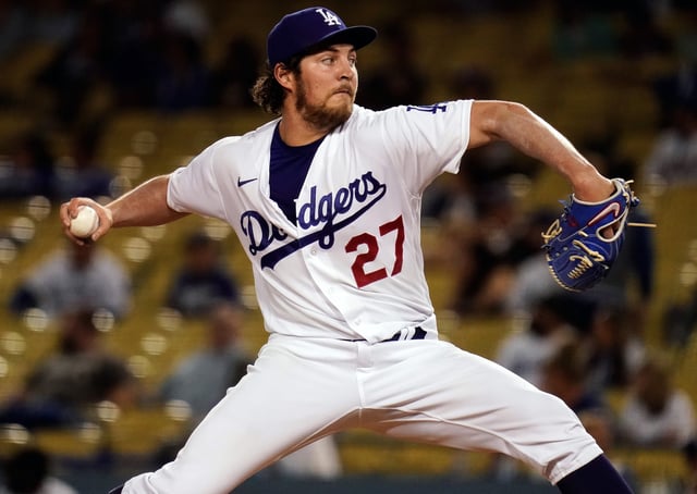 Jun 12, 2021; Los Angeles, California, USA; Los Angeles Dodgers starting pitcher Trevor Bauer (27) throws a pitch against the Texas Rangers in the fourth inning at Dodger Stadium. Mandatory Credit: Robert Hanashiro-USA TODAY Sports