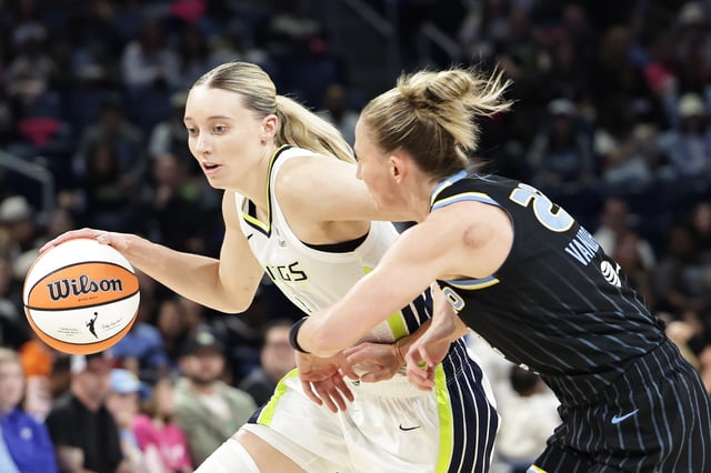 Paige Bueckers #5 of the Dallas Wings drives past Courtney Vandersloot #22 of the Chicago Sky during the first half at Wintrust Arena on May 29, 2025 in Chicago, Illinois.