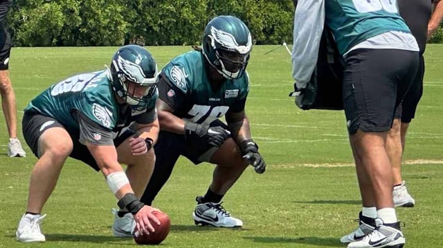 Eagles rookie Drew Kendall gets ready to snap the ball with veteran Kenyon Green at left guard during an OTA on June 3, 2025.