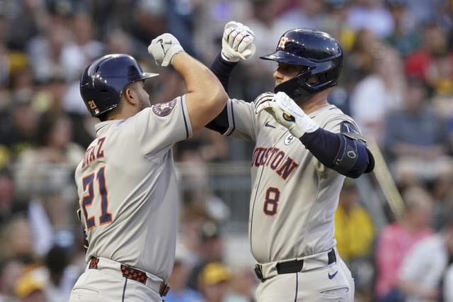 Houston Astros&#39; Christian Walker, right, is greeted by Yainer Diaz, left, after hitting a home run during the seventh inning of a baseball game against the Pittsburgh Pirates, Tuesday, June 3, 2025, in Pittsburgh. (AP Photo/Matt Freed)