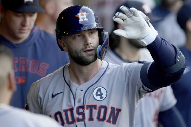 Houston Astros&#39; Christian Walker celebrates in the dugout after hitting a home run during the seventh inning of a baseball game against the Pittsburgh Pirates, Tuesday, June 3, 2025, in Pittsburgh. (AP Photo/Matt Freed)