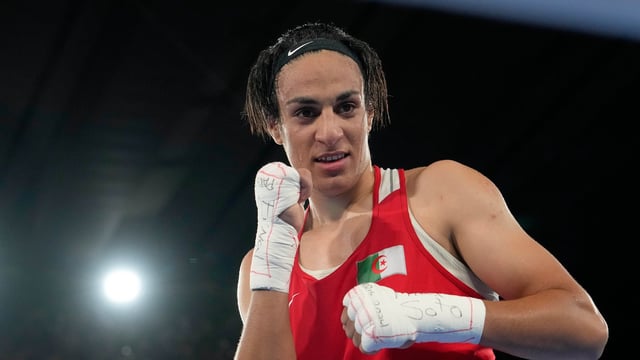 Algeria's Imane Khelif poses after defeating China's Yang Liu to win gold in their women's 66 kg final boxing match at the 2024 Summer Olympics, Friday, Aug. 9, 2024, in Paris, France. (AP Photo/Ariana Cubillos, File)