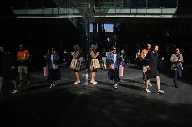 People walk outside a shopping mall in the Sydney Central Business District, in Sydney, Australia, May 14, 2024. REUTERS/Jaimi Joy/File Photo