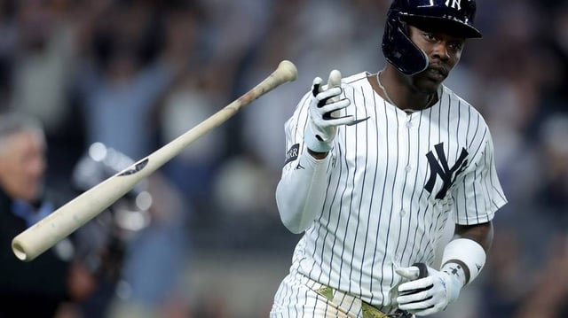 Jun 3, 2025; Bronx, New York, USA; New York Yankees third baseman Jazz Chisholm Jr. (13) flips his bat after hitting a solo home run against the Cleveland Guardians during the seventh inning at Yankee Stadium. Mandatory Credit: Brad Penner-Imagn Images