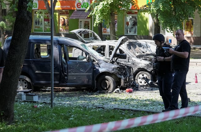 Police officers stand at the site of Russian military strike, amid Russia's attack on Ukraine in Sumy, June 3, 2025. REUTERS/Stringer