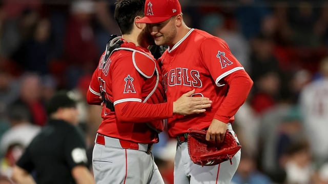 Los Angeles Angels catcher Travis d’Arnaud, left, and pitcher Reid Detmers celebrate after the final out in a 4-3 win in 10 innings against the Boston Red Sox at Fenway Park on Tuesday, June 3, 2025, in Boston. (Elsa/Getty Images/TNS)