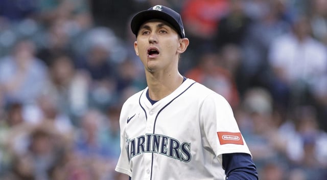 Seattle Mariners starting pitcher George Kirby heads to the dugout after getting hit in the face by the ball during the fifth inning of a baseball game against the Baltimore Orioles, Tuesday, June 3, 2025, in Seattle. (AP Photo/Jason Redmond)