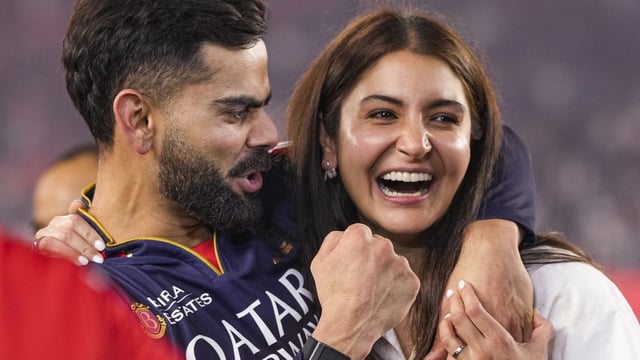 Virat Kohli celebrates with Anushka Sharma after winning IPL 2025. 