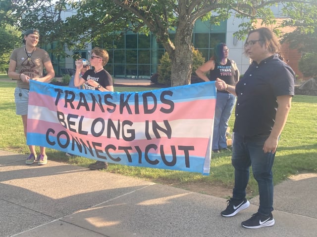 Supporters of transgender students at a rally Tuesday night outside Cromwell High School. (Don Stacom/The Hartford Courant)