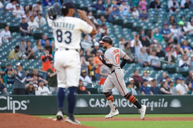 Baltimore Orioles&#39; Colton Cowser jogs the bases after hitting a home run off Seattle Mariners pitcher Eduard Bazardo (83) during the sixth inning of a baseball game, Tuesday, June 3, 2025, in Seattle. (AP Photo/Jason Redmond)