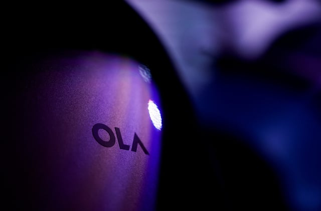 The Ola company logo is seen on one of its electric scooters, ahead of the company's IPO launch in Mumbai, India, July 29, 2024. REUTERS/Francis Mascarenhas/File Photo