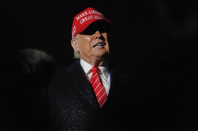 President Donald Trump speaks to reporters in the rain after arriving on Air Force One at Joint Base Andrews, Md., Friday, May 30, 2025.