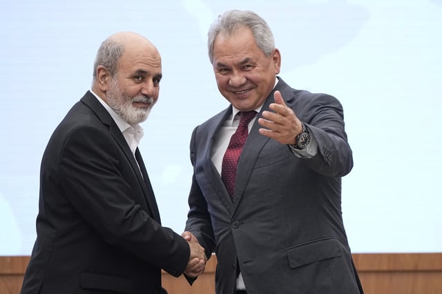 Russian Security Council Secretary Sergei Shoigu, right, and Secretary of Iranian National Security Council Ali Akbar Ahmadian shake hands during the 13th International Meeting of High Representatives for Security Issues in Moscow, Russia, Wednesday, May 28, 2025. (AP Photo/Alexander Zemlianichenko)