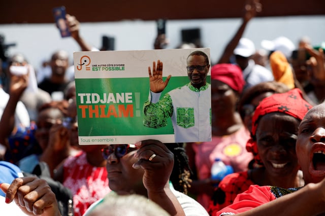 Partisans of PDCI (Democratic Party of Cote d'Ivoire) protest against the Ivorian justice decision to remove their leader Tidjane Thiam from the electoral list, at their headquarters in Abidjan, Ivory Coast April 24, 2025. REUTERS/Luc Gnago/File Photo
