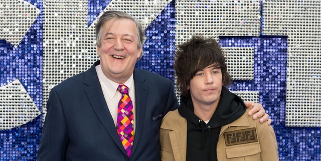 Stephen Fry and Elliott Spencer in 2019. (Getty)