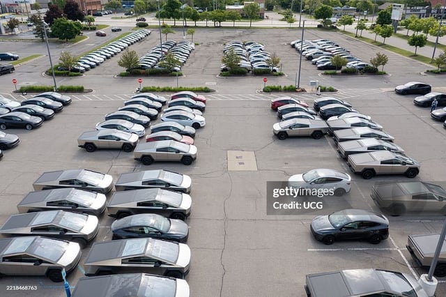Tesla is facing backlash from local authorities in Michigan for storing Cybertrucks and other unsold vehicles in the parking lot of a rundown shopping center.
