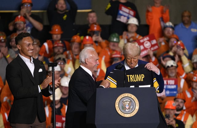 U.S. President Donald Trump receives a Pittsburgh Steeler jersey from Rocky Bleier during a rally at the US Steel-Irvin Works on May 30, 2025 in West Mifflin, Pennsylvania.