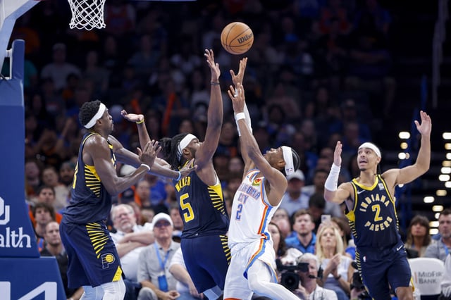 Thunder guard Shai Gilgeous-Alexander shoots as Indiana Pacers forward Jarace Walker defends in Oklahoma City on March 29, 2025.