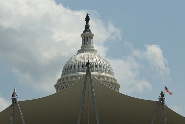 The dome of the Capitol is seen beyond an entertainment canopy, in Washington, D.C., U.S., May 16, 2025. REUTERS/Kevin Lamarque/File Photo