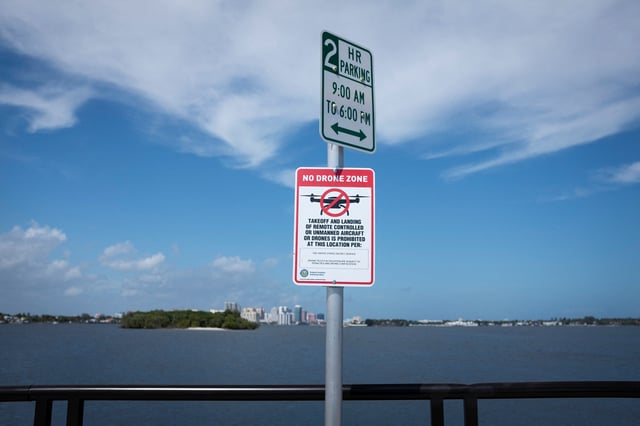 A no drone zone sign is seen in Lake Worth Lagoon behind U.S. President Donald Trump's Mar-a-Lago home, in Palm Beach, Florida. February 16, 2023.